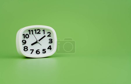 Photo for Modern alarm clock with clock hands standing still Working with time, being punctual, time is valuable to work and life. - Royalty Free Image