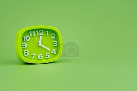 Photo for Modern alarm clock with clock hands standing still Working with time, being punctual, time is valuable to work and life. - Royalty Free Image
