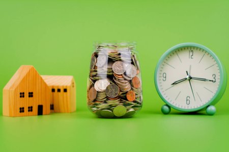Money and time, savings, coins in a glass jar, financial planning financial investment Income, cash flow and living expenses