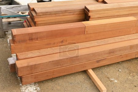 Photo for Delivery work of Billian ( Borneo ironwood ) used for wooden decks. Billian (Ulin) is a Lauraceae tree native to Borneo. It is hard and very resistant to corrosion, so it is used for wooden decks. - Royalty Free Image