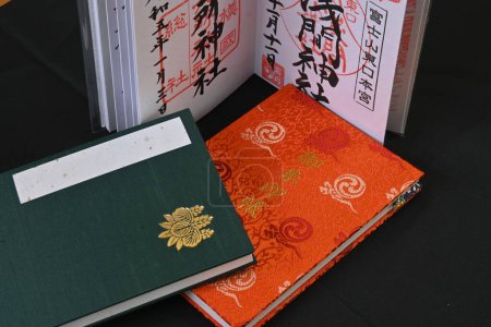 Photo for 'Goshuin', as it is called in Japan, is a seal that is handwritten by a monk and is given to worshipers at shrines and temples. Also, the notebook used for goshuin is called 'Goshuincho'. - Royalty Free Image