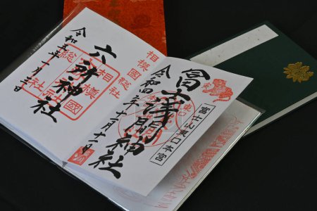 Photo for 'Goshuin', as it is called in Japan, is a seal that is handwritten by a monk and is given to worshipers at shrines and temples. Also, the notebook used for goshuin is called 'Goshuincho'. - Royalty Free Image