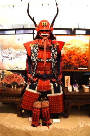 Photo for Japan tourism, Japanese history and culture. Old Japanese combat uniform 'Yoroi' and 'Kabuto'. Japanese Armor and Samurai Warrior helmet. - Royalty Free Image