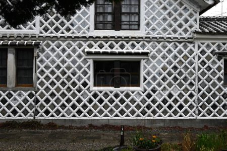 Japan Travel. Traditional Japanese wall pattern, called Namako Wall in Japan. A wall covered square tiles jointed with raised plaster. Matsuzaki Town, Shizuoka Prefecture, Japan.