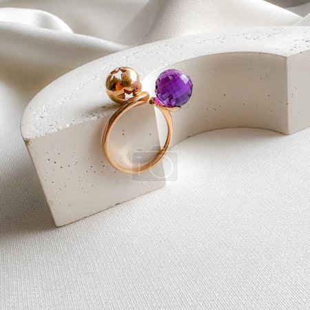 Photo for Stylish modern purple amethyst ring in rose gold. - Royalty Free Image