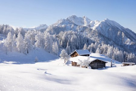 Traditional wooden house in the Alps covered with snow. High quality photo