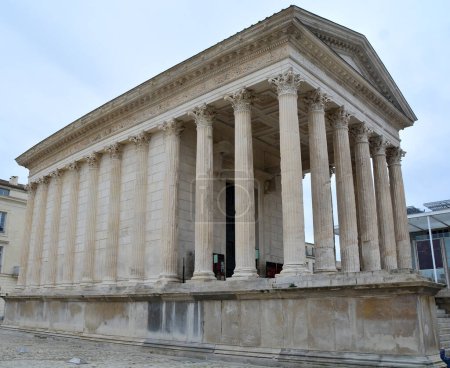 Photo for The Maison Carree in the centre of Nimes, Southern France. This is a 2,000 year old Ancient Roman Temple the best preserved of its kind anywhere - Royalty Free Image