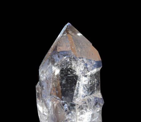 Photo for A piece of clear quartz found on the Mt Blanc in France, known as smokey quartz. Isolated against a black background - Royalty Free Image
