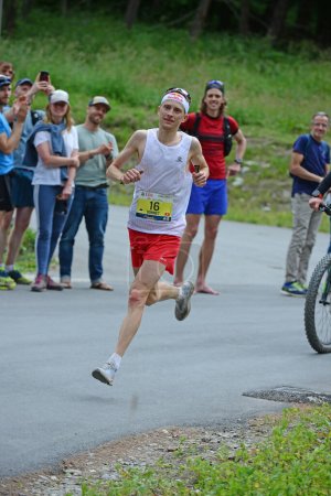 Photo for Zinal, SWITZERLAND - AUGUST 7: Elite runner, Remi BONNET (SUI) arriving in the Sierre-Zinal World ChampionshipTrail Race:  August 7, 2021 in Zinal, Switzerland - Royalty Free Image