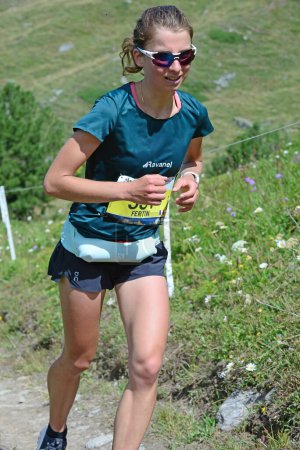 Photo for Zinal, SWITZERLAND - AUGUST 7: Elite runner, Candice FERTIN (FRA) in the Sierre-Zinal World ChampionshipTrail Race:  August 7, 2021 in Zinal, Switzerland - Royalty Free Image
