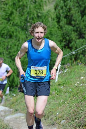 Photo for Zinal, SWITZERLAND - AUGUST 7: Elite runner, Nine ZOLLER (SUI) in the Sierre-Zinal World ChampionshipTrail Race:  August 7, 2021 in Zinal, Switzerland - Royalty Free Image