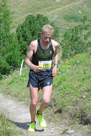 Photo for Zinal, SWITZERLAND - AUGUST 7: Elite runner, Frederic TRANCHAND team Scott in the Sierre-Zinal World ChampionshipTrail Race:  August 7, 2021 in Zinal, Switzerland - Royalty Free Image