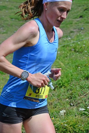 Photo for Zinal, SWITZERLAND - AUGUST 7: Elite runner, Judith WYDER (SUI) in the Sierre-Zinal World ChampionshipTrail Race:  August 7, 2021 in Zinal, Switzerland - Royalty Free Image