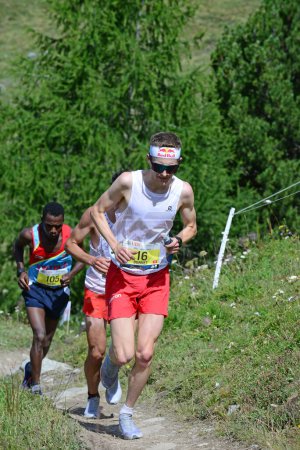 Photo for Zinal, SWITZERLAND - AUGUST 7: Elite runner, Remi Bonnet (F) of the Salomon Team in the Sierre-Zinal World ChampionshipTrail Race:  August 7, 2021 in Zinal, Switzerland - Royalty Free Image