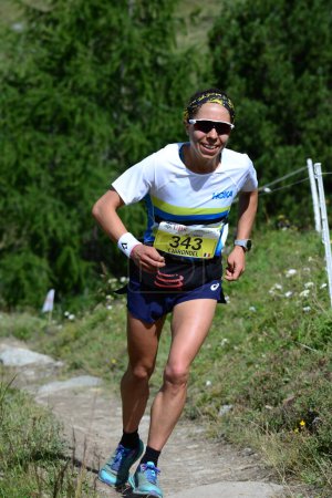 Photo for Zinal, SWITZERLAND - AUGUST 7: World Champion Blandine L'hirondelle (F)  in the Sierre-Zinal World ChampionshipTrail Race:  August 7, 2021 in Zinal, Switzerland - Royalty Free Image