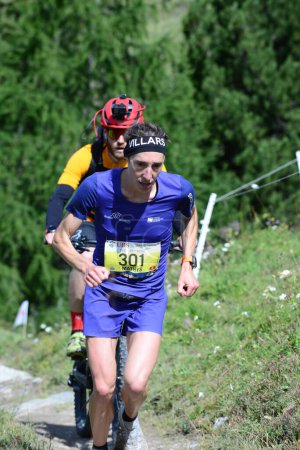 Photo for Zinal, SWITZERLAND - AUGUST 7: Elite runner, Maude Mathys winner of the Sierre-Zinal World ChampionshipTrail Race:  August 7, 2021 in Zinal, Switzerland - Royalty Free Image