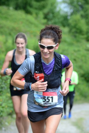 Téléchargez les photos : THYON, SUISSE - 31 JUILLET : La coureuse élite Cristina Ribeiro du Portugal dans la course Thyon-Dixence Trail : 31 juillet 2021 à Thyon, Suisse - en image libre de droit