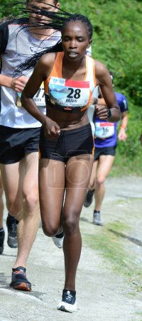 Téléchargez les photos : THYON, SUISSE - 31 JUILLET : Elite runner, Kajuju Gitonga, vainqueur de la Thyon-Dixence Trail Race : 31 juillet 2021 à Thyon, Suisse - en image libre de droit