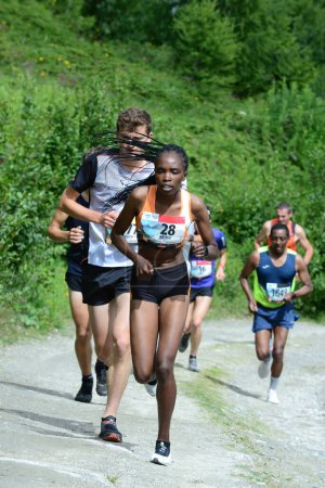 Téléchargez les photos : THYON, SUISSE - 31 JUILLET : Elite runner, Kajuju Gitonga, vainqueur de la Thyon-Dixence Trail Race : 31 juillet 2021 à Thyon, Suisse - en image libre de droit