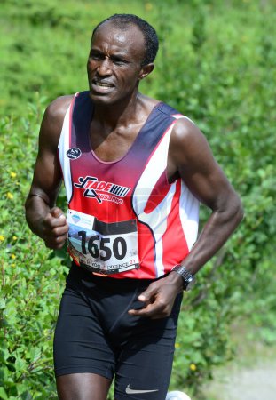 Photo for THYON, SWITZERLAND - JULY 31: Elite runner, Tolossa Chengere of Ethiopia in the Thyon-Dixence Trail Race:  July 31, 2021 in Thyon, Switzerland - Royalty Free Image