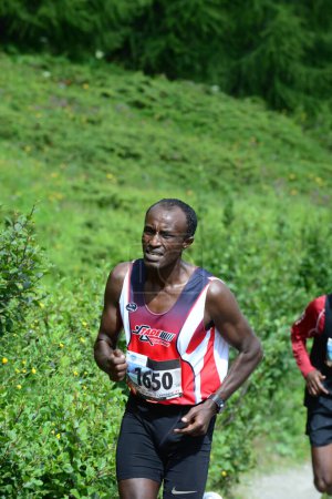 Photo for THYON, SWITZERLAND - JULY 31: Elite runner, Tolossa Chengere of Ethiopia in the Thyon-Dixence Trail Race:  July 31, 2021 in Thyon, Switzerland - Royalty Free Image