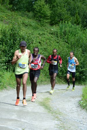 Photo for THYON, SWITZERLAND - JULY 31: Christian Vasconez of Ecuador  ahead of Tolossa Chengere of Ethiopia in the Thyon-Dixence Trail Race:  July 31, 2021 in Thyon, Switzerland - Royalty Free Image
