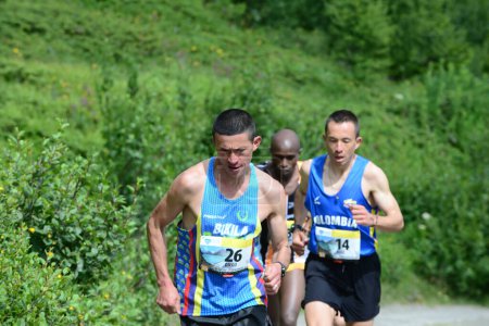 Photo for THYON, SWITZERLAND - JULY 31: Elite runner, Diego Vera of Columbia  in the Thyon-Dixence Trail Race:  July 31, 2021 in Thyon, Switzerland - Royalty Free Image