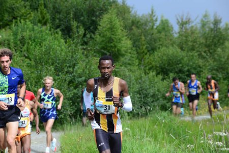 Photo for THYON, SWITZERLAND - JULY 31: Elite runner, Lengen Lolkurraru winner of the Thyon-Dixence Trail Race:  July 31, 2021 in Thyon, Switzerland - Royalty Free Image
