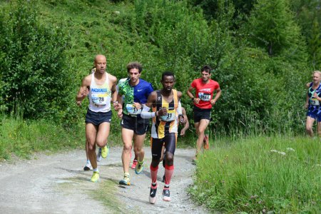 Photo for THYON, SWITZERLAND - JULY 31: Elite runner Lengen Lolkurraru leading  in the Thyon-Dixence Trail Race:  July 31, 2021 in Thyon, Switzerland - Royalty Free Image