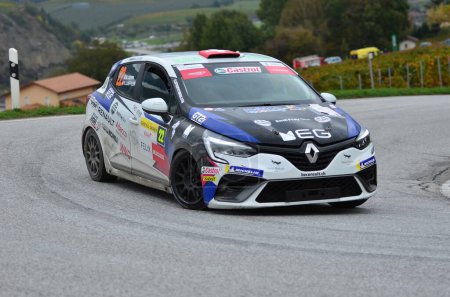 Photo for CHALAIS, SWITZERLAND - OCTOBER 15: Coppa and Loeffler in their Renault Clio driving the in the International Rally du Valais:  October 15, 2022 in Chalais, Switzerland - Royalty Free Image