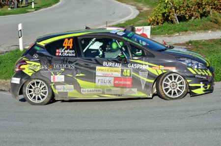 Photo for CHALAIS, SWITZERLAND - OCTOBER 15: Lamon and Corsini in their Peugeot 208 driving the in the International Rally du Valais:  October 15, 2022 in Chalais, Switzerland - Royalty Free Image