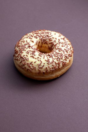 Photo for Vanilla doughnut on brown background - Royalty Free Image