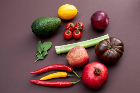 Photo for Fruits and vegetables on brown background - Royalty Free Image