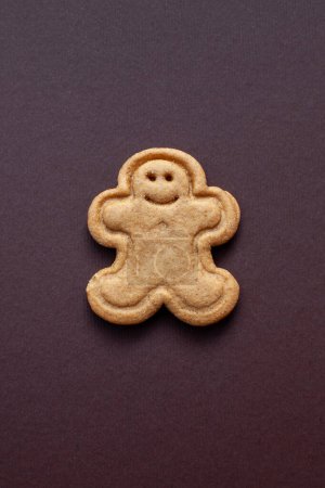 Photo for Gingerbread cookie on brown background - Royalty Free Image