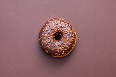Photo for Chocolate doughnut isolated on brown background - Royalty Free Image