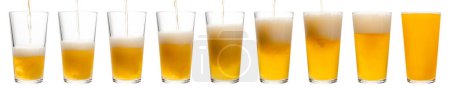 Foto de IPA or APA ale beer is pouring into shaker pint glass isolated on a white background - Imagen libre de derechos