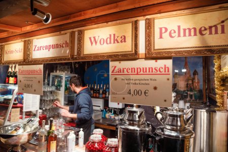 Photo for Berlin, Germany - December 12, 2018: Russian themed Christmas market stall offering Zarenpunsch (Tsar's punch), Wodka (Vodka) and Pelmeni (Russian style dumplings) - Royalty Free Image