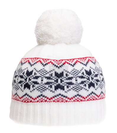 Photo for White knitted winter bobble hat decorated with Scandinavian geometric ornament. Handmade woolly cap with pompom on top - Royalty Free Image