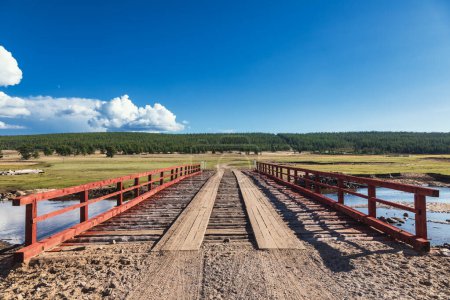 Photo for Wooden bridge over a river in Khovsgol Province of northern Mongolia - Royalty Free Image