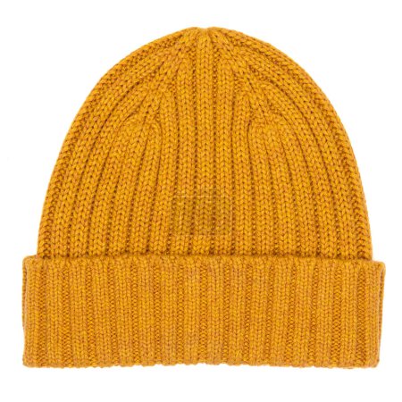 Photo for Pale orange knitted winter bobble hat of traditional design flat lay isolated on white background - Royalty Free Image
