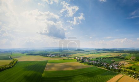 Photo for Bobolice, aerial view of polish village, Lower Silesian panoramic landscape. Drone view of beautiful, countryside landscape. Late spring, Poland. - Royalty Free Image