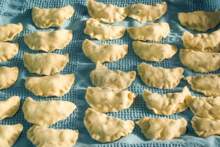 Photo for Step by step making blueberry dumplings pierogi varenky at home. Process of making traditional summer polish or ukrainian dish with flour and fruits - Royalty Free Image
