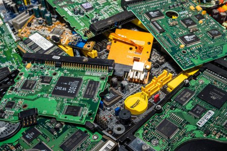 Opole, Poland - 08.07.2023 - electronic waste, used PCB (printed circuit board) prepared for recycling. Concept photo of eco, sorting, and disposal of electronics. 