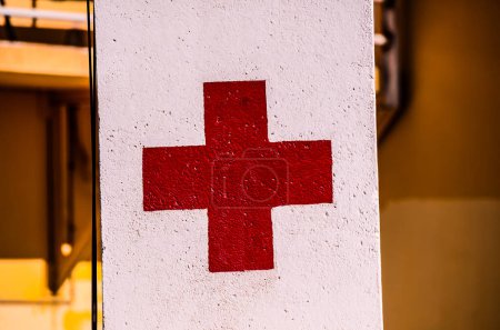 Red Cross Medical Sign Over a White Background