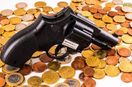 Picture of a Business Money Concept Idea Coins and Gun