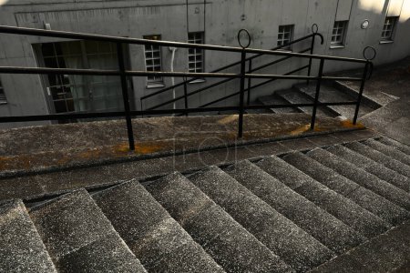Photo for Concrete staircase with a retro and modern design on a dimly lit slope - Royalty Free Image