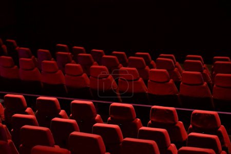 Red seats lined up in the theater