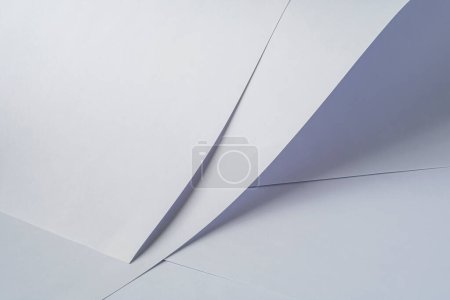 Two large sheets of white paper on a light background.