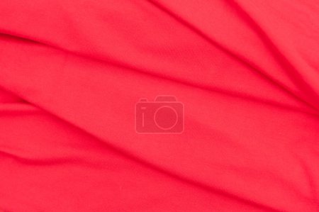 Foto de Paño de algodón elástico rojo primer plano fondo textil con pliegues en él, vista superior - Imagen libre de derechos