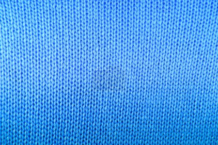 Téléchargez les photos : Tricot textile gros plan fond bleu couleur - en image libre de droit